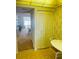Kitchen area with yellow linoleum flooring, eat-in kitchen table, and view at 6020 Shore S Blvd # 903, Gulfport, FL 33707