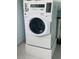 Efficient laundry area showcases a modern stacked washer and dryer, optimizing space for convenient chore management at 6020 Shore S Blvd # 903, Gulfport, FL 33707