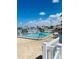 Enjoy the community's outdoor pool, perfect for relaxation and recreation with scenic views on a sunny day at 6020 Shore S Blvd # 903, Gulfport, FL 33707