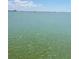 Calm and wide water view under a sunny sky with hazy buildings on the horizon at 6020 Shore S Blvd # 903, Gulfport, FL 33707