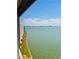 Expansive water view showcasing serene turquoise waters and distant cityscape from a window at 6020 Shore S Blvd # 903, Gulfport, FL 33707