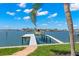 Private boat dock with boat lift, providing convenient access to the open bay and Gulf of Mexico at 6130 Kipps Colony W Dr, Gulfport, FL 33707