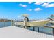 View of the boat lift at the private dock, ready for boating on the open bay and Gulf of Mexico at 6130 Kipps Colony W Dr, Gulfport, FL 33707