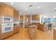 Spacious kitchen with wood cabinets, island, and views to the water at 6130 Kipps Colony W Dr, Gulfport, FL 33707