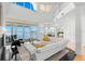 Spacious living room featuring high ceilings, water views, and modern finishes, perfect for entertaining at 6130 Kipps Colony W Dr, Gulfport, FL 33707
