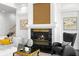 Cozy living room featuring a fireplace, comfortable seating, and stylish decor at 6130 Kipps Colony W Dr, Gulfport, FL 33707