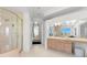 Elegant bathroom with an enclosed shower, vanity, and luxurious details throughout the space at 6130 Kipps Colony W Dr, Gulfport, FL 33707