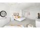 Spacious main bedroom with sitting area, neutral carpet, recessed lighting, and a tray ceiling at 6130 Kipps Colony W Dr, Gulfport, FL 33707
