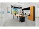 Bright office with large windows, built in desk, shelving and storage space at 6130 Kipps Colony W Dr, Gulfport, FL 33707