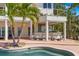 Enjoy outdoor entertaining with this covered bar, pool side, featuring seating for six at 6130 Kipps Colony W Dr, Gulfport, FL 33707