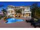 Outdoor pool and patio area with bar seating for entertaining and relaxing by the water at 6130 Kipps Colony W Dr, Gulfport, FL 33707
