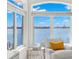 Relaxing sitting area with waterfront views through expansive windows at 6130 Kipps Colony W Dr, Gulfport, FL 33707