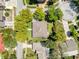 Overhead shot of a house with mature trees and a well-manicured lawn at 631 Baynard Dr, Tarpon Springs, FL 34689