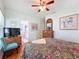 Bedroom featuring a TV, ceiling fan, dresser, and ensuite bathroom at 631 Baynard Dr, Tarpon Springs, FL 34689