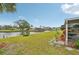 Expansive backyard featuring a lush lawn with water views and access at 6357 Spanish Main Dr, Apollo Beach, FL 33572