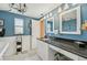 Stylish bathroom features a sleek black granite countertop and plenty of natural light at 6357 Spanish Main Dr, Apollo Beach, FL 33572