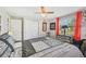 Unique bedroom featuring zebra print drawers and accents, as well as red curtains at 6357 Spanish Main Dr, Apollo Beach, FL 33572