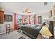 Unique bedroom featuring zebra print drawers and accents, as well as red curtains at 6357 Spanish Main Dr, Apollo Beach, FL 33572