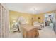Bright bedroom boasts a charming chandelier, mirrored nightstands and a comfortable seating area at 6357 Spanish Main Dr, Apollo Beach, FL 33572