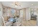 Charming dining area with a glass table set near a window, complemented by decorative wallpaper at 6357 Spanish Main Dr, Apollo Beach, FL 33572