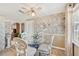 Charming dining room featuring a glass table, stylish chairs, and an elegant decor at 6357 Spanish Main Dr, Apollo Beach, FL 33572