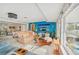Inviting Gathering room with a modern design and large windows overlooking the outdoor views at 6357 Spanish Main Dr, Apollo Beach, FL 33572
