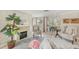 Tastefully decorated living room with a fireplace and elegant furnishings for a cozy ambiance at 6357 Spanish Main Dr, Apollo Beach, FL 33572