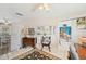 Open living space featuring a glimpse of the kitchen and dining area, and a view to the exterior at 6357 Spanish Main Dr, Apollo Beach, FL 33572