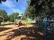Playground with colorful equipment and a soft surface, providing a fun and safe area for children to play at 6357 Spanish Main Dr, Apollo Beach, FL 33572