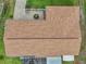 Aerial view of a well-maintained roof with a brick patio and garden area and fenced in area at 6357 Spanish Main Dr, Apollo Beach, FL 33572