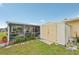 Backyard exterior showing a shed near the screened patio, ideal for storage at 6357 Spanish Main Dr, Apollo Beach, FL 33572