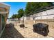 Paver patio with decorative gazebo, privacy fence, and brick retaining wall for outdoor enjoyment at 6831 Greenwich Ave, New Port Richey, FL 34653