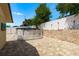 Spacious backyard features paver patio, above ground pool, and privacy fencing for secure outdoor enjoyment at 6831 Greenwich Ave, New Port Richey, FL 34653