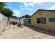 Paved backyard patio area with metal gazebo, outdoor furniture, and privacy fence at 6831 Greenwich Ave, New Port Richey, FL 34653