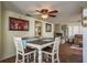 Comfortable dining area and decorative fireplace with beautiful flooring at 6831 Greenwich Ave, New Port Richey, FL 34653