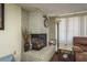 Close-up of the decorative white brick fireplace, showcasing its detailed craftsmanship and cozy ambiance at 6831 Greenwich Ave, New Port Richey, FL 34653