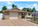 Attractive single-Gathering home with an attached garage, manicured lawn and neutral exterior at 6831 Greenwich Ave, New Port Richey, FL 34653