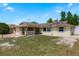 Charming single-story home featuring a brick facade and an attached garage, inviting curb appeal at 6831 Greenwich Ave, New Port Richey, FL 34653