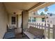 Charming covered porch with brick column, picket fence, and comfortable seating arrangement at 6831 Greenwich Ave, New Port Richey, FL 34653