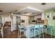 Open kitchen featuring stainless steel appliances, breakfast bar, and ample cabinet space at 6831 Greenwich Ave, New Port Richey, FL 34653