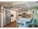 Modern kitchen with stainless steel appliances, countertop seating, and tiled backsplash at 6831 Greenwich Ave, New Port Richey, FL 34653