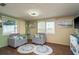 Cozy living room with plush seating, natural light, and contemporary decor at 6831 Greenwich Ave, New Port Richey, FL 34653