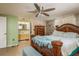 Spacious main bedroom with luxurious furnishings, natural lighting, and en-suite bathroom at 6831 Greenwich Ave, New Port Richey, FL 34653