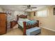 Spacious main bedroom with luxurious bed and stone-accented wall at 6831 Greenwich Ave, New Port Richey, FL 34653