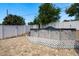 Backyard with above ground pool, brick patio, and white privacy fence at 6831 Greenwich Ave, New Port Richey, FL 34653