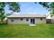 A spacious backyard features a well-maintained lawn at 7338 Coventry Dr, Port Richey, FL 34668