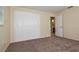 Bedroom with carpet flooring and double door closet at 7338 Coventry Dr, Port Richey, FL 34668