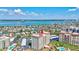 Beautiful aerial view showing condos with water views, a marina, and surrounding waterfront homes at 736 Island Way # 303, Clearwater Beach, FL 33767