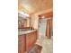 Bathroom boasts granite counters, earth tone color palette, and shower with tub at 736 Island Way # 303, Clearwater Beach, FL 33767