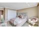 Cozy bedroom with neutral tones, a double bed and bright light, creating a relaxing atmosphere at 736 Island Way # 303, Clearwater Beach, FL 33767